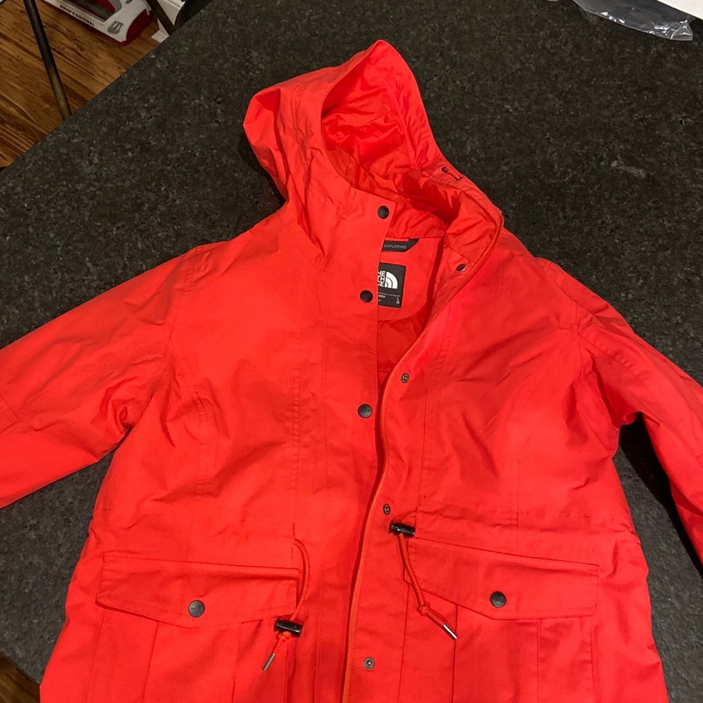 The North Face TNF red waterproof rain coat